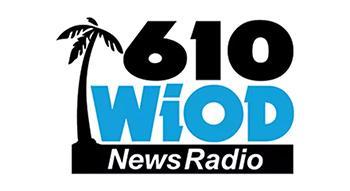 Logo for WIOD News Radio 610 featuring a black palm tree, large black numbers 610, blue letters WiOD, and News Radio in white text on a black background strip.