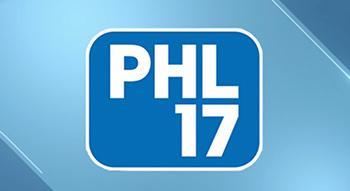 Blue logo with white text reading PHL 17 inside a rounded square on a light blue gradient background with diagonal lines.