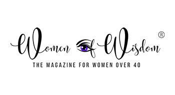 Logo with the text Women of Wisdom in cursive, separated by an illustrated eye with a purple iris. Below, in uppercase letters, it reads THE MAGAZINE FOR WOMEN OVER 40.
