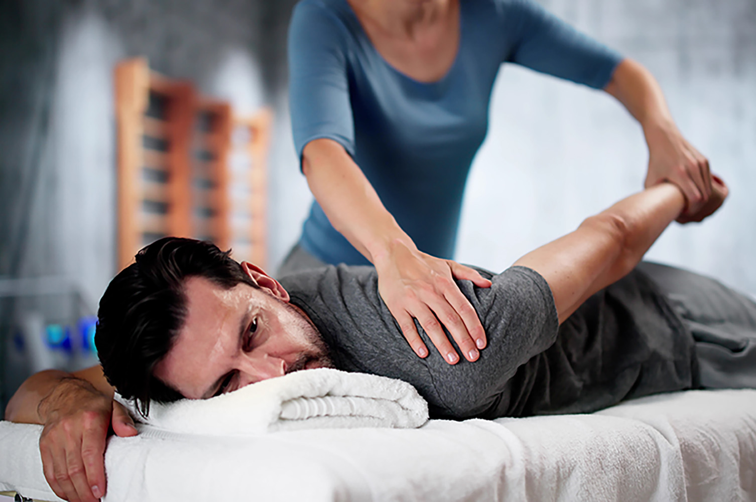 Man receiving adjustment on shoulder